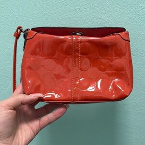 Coach Embossed Orange Patent Leather Wristlet